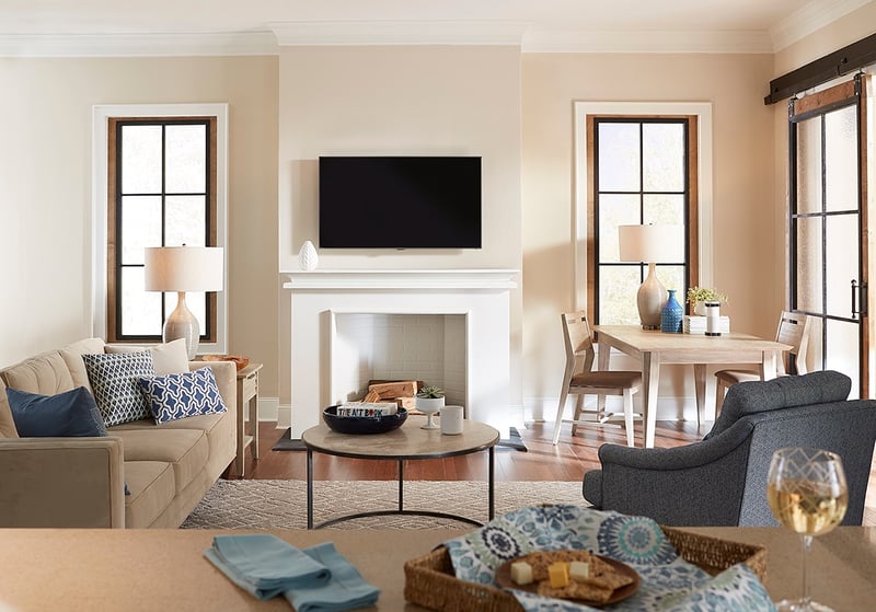 TV mounted above fireplace in open concept room