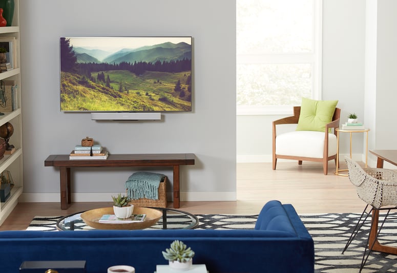 mounted tv with small piece of furniture
